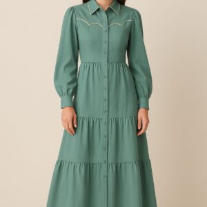 Model wearing sea green EZZA BEE maxi dress with long sleeves and button-down front